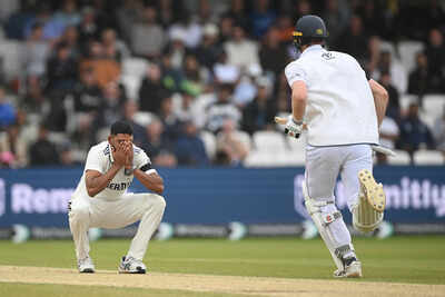 Dejected Mohammed Siraj watches England build their lead.