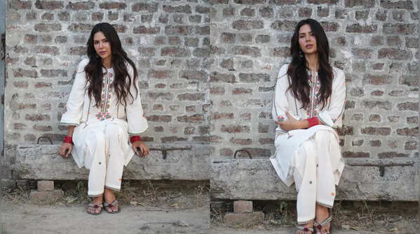 Sonam Bajwa's white suit with floral embroidery.