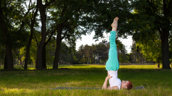 Executing Sarvangasana for thyroid stimulation