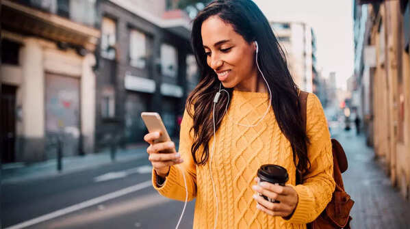 Image of holding phone with one hand, scrolling with thumb.