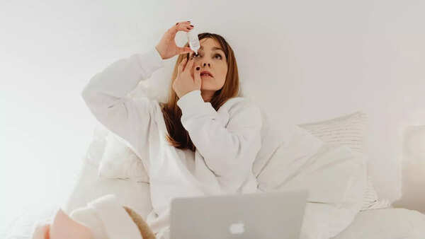 Using cotton pads with rose water for eye care